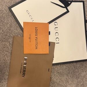 Gucci and Burberry Shopping Bags with Louis Vuitton Envelope